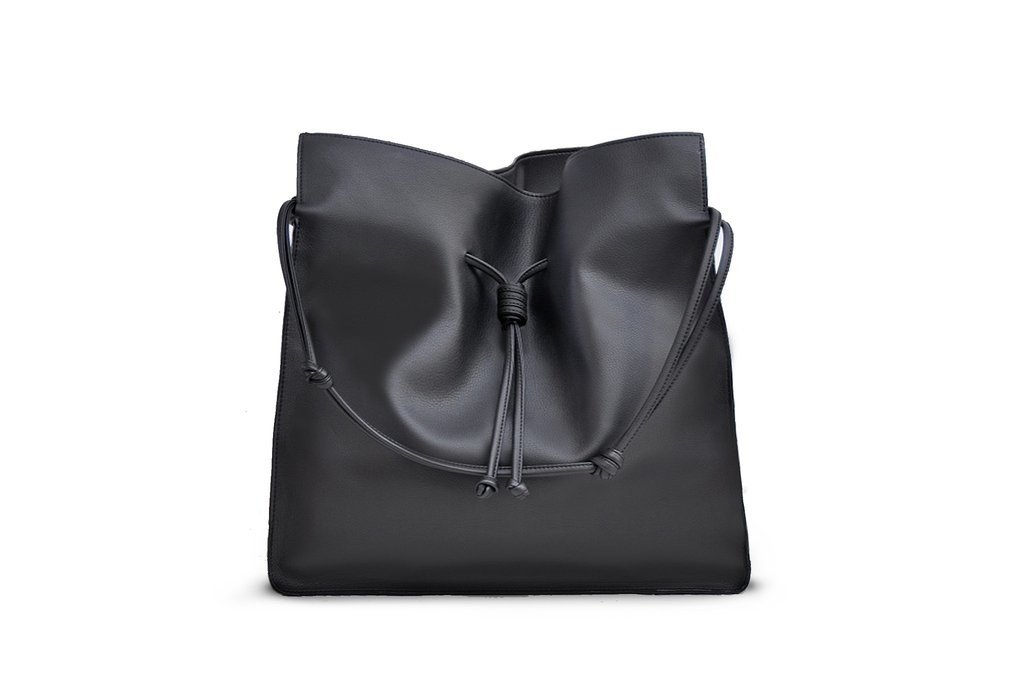Influencers + Tastemakers Style + Design Travel Shop Trip Ideas black bag indoor handbag product shoulder bag leather accessory product design brand case