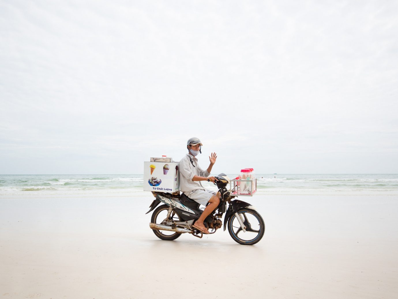 sky outdoor water Beach vehicle Sea Coast sand bicycle motorcycle shore sandy