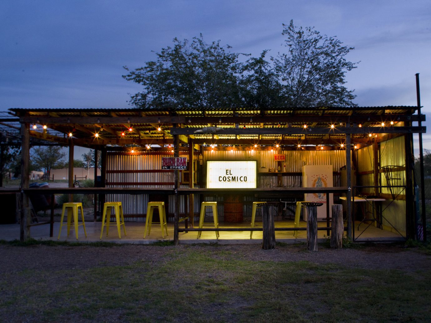 artistic artsy Bar bar seating dusk Glamping Hip isolation lights Nature night lights Night Sky Nightlife outdoor bar Outdoors Outdoors + Adventure quirky remote Rustic trees trendy Weekend Getaways outdoor sky grass night evening home sign