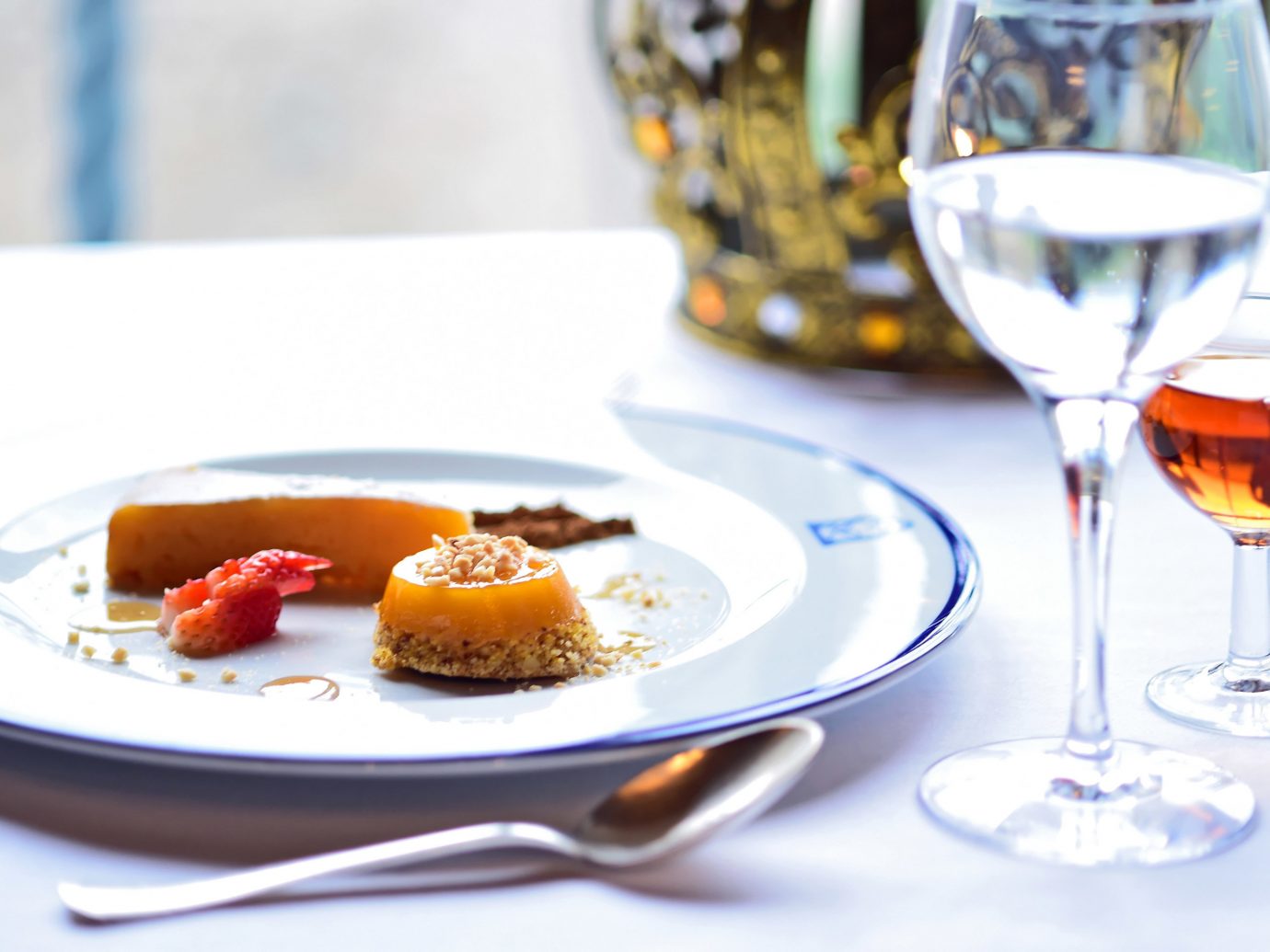 Hotels table plate wine food indoor meal dish produce dessert breakfast fruit
