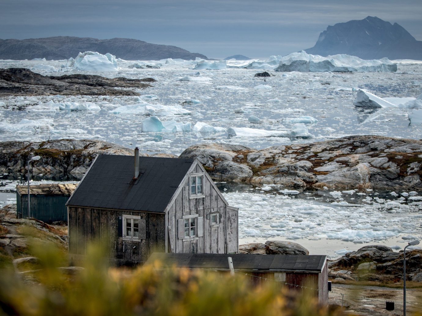 A house in Tiniteqilaaq with a view of the Sermilik Icefjord in East Greenland