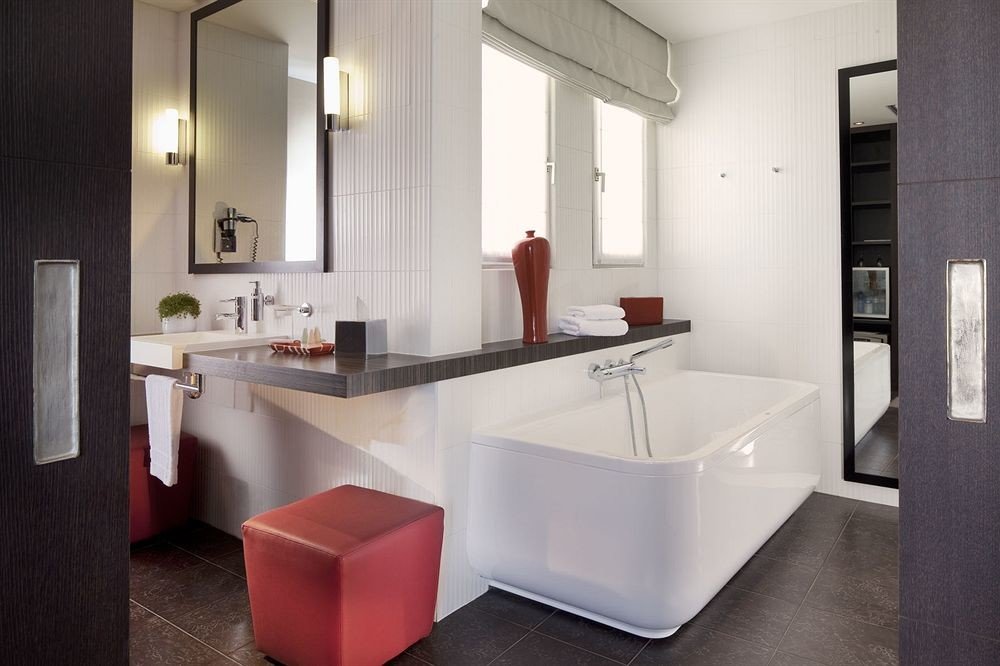bathroom property mirror sink countertop bathtub home plumbing fixture Kitchen flooring Suite tub