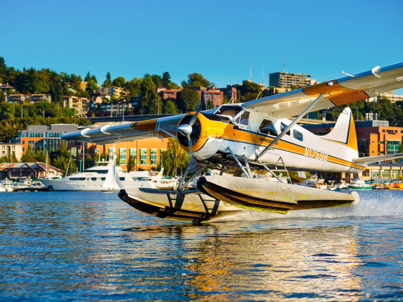 Trip Ideas sky outdoor water seaplane airplane water transportation aircraft Boat waterway atmosphere of earth light aircraft yellow leisure reflection boating aviation Harbor