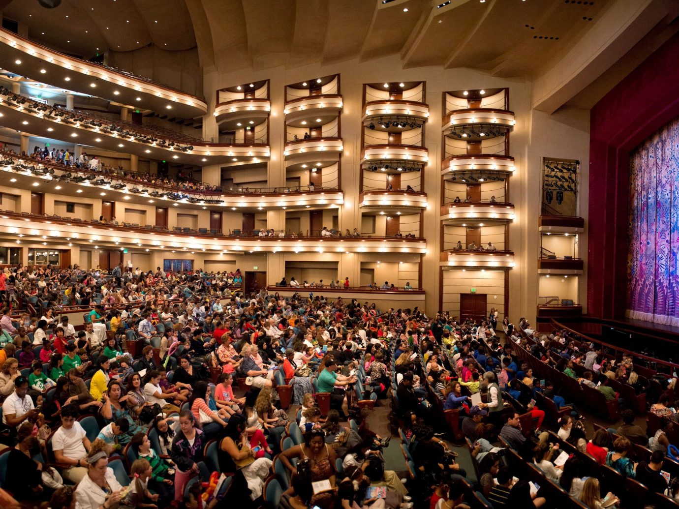 Budget indoor person ceiling crowd audience people auditorium stage musical theatre theatre convention hall