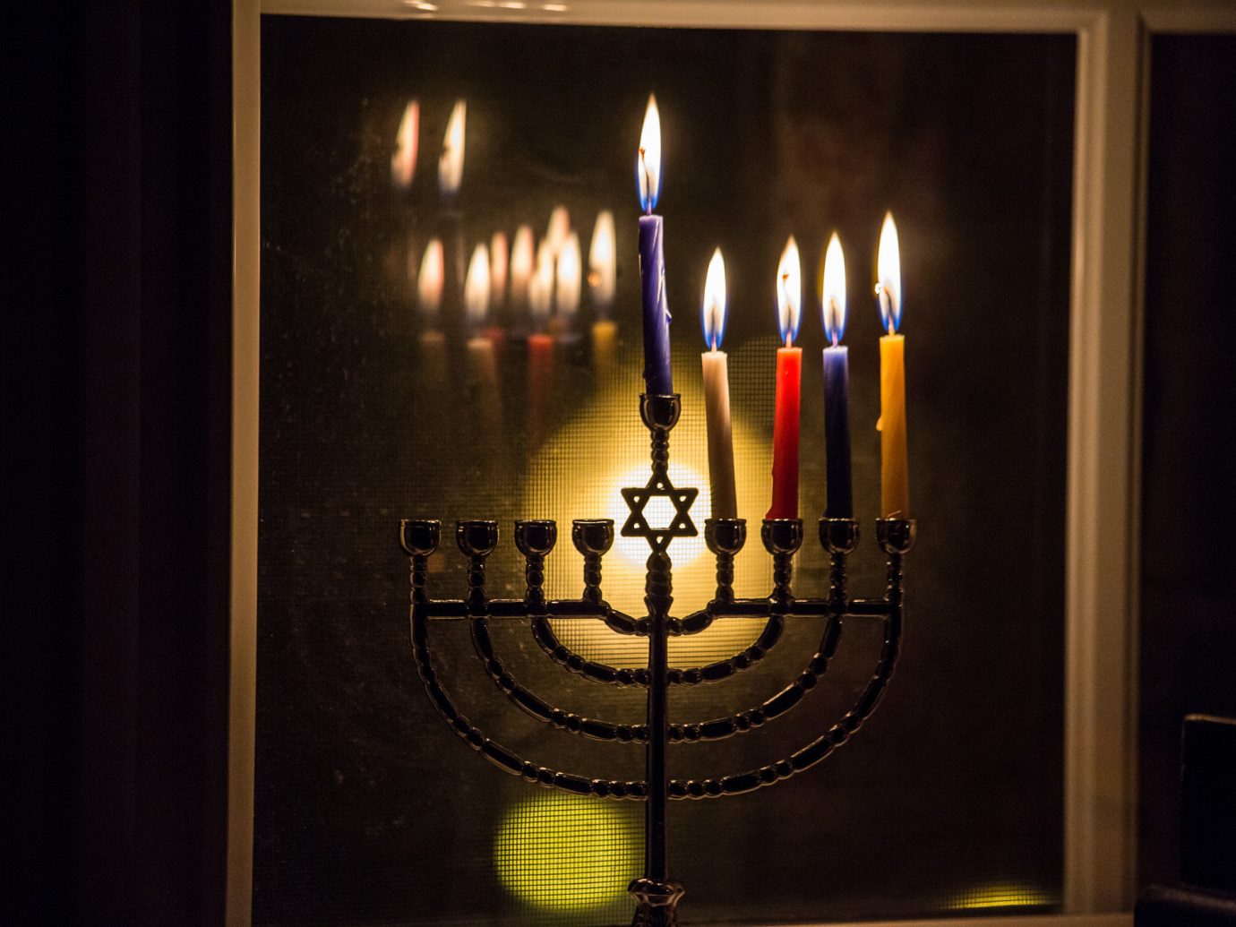Trip Ideas candelabrum indoor candle light darkness lighting lit glass symmetry hanukkah