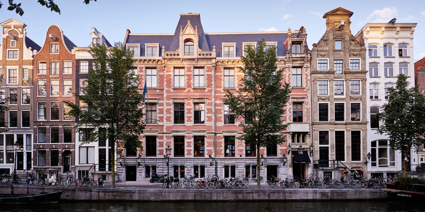 Amsterdam Boutique Hotels Hotels The Netherlands building sky water outdoor Canal landmark City waterway Town urban area neighbourhood human settlement Architecture house River cityscape Downtown estate facade town square surrounded several