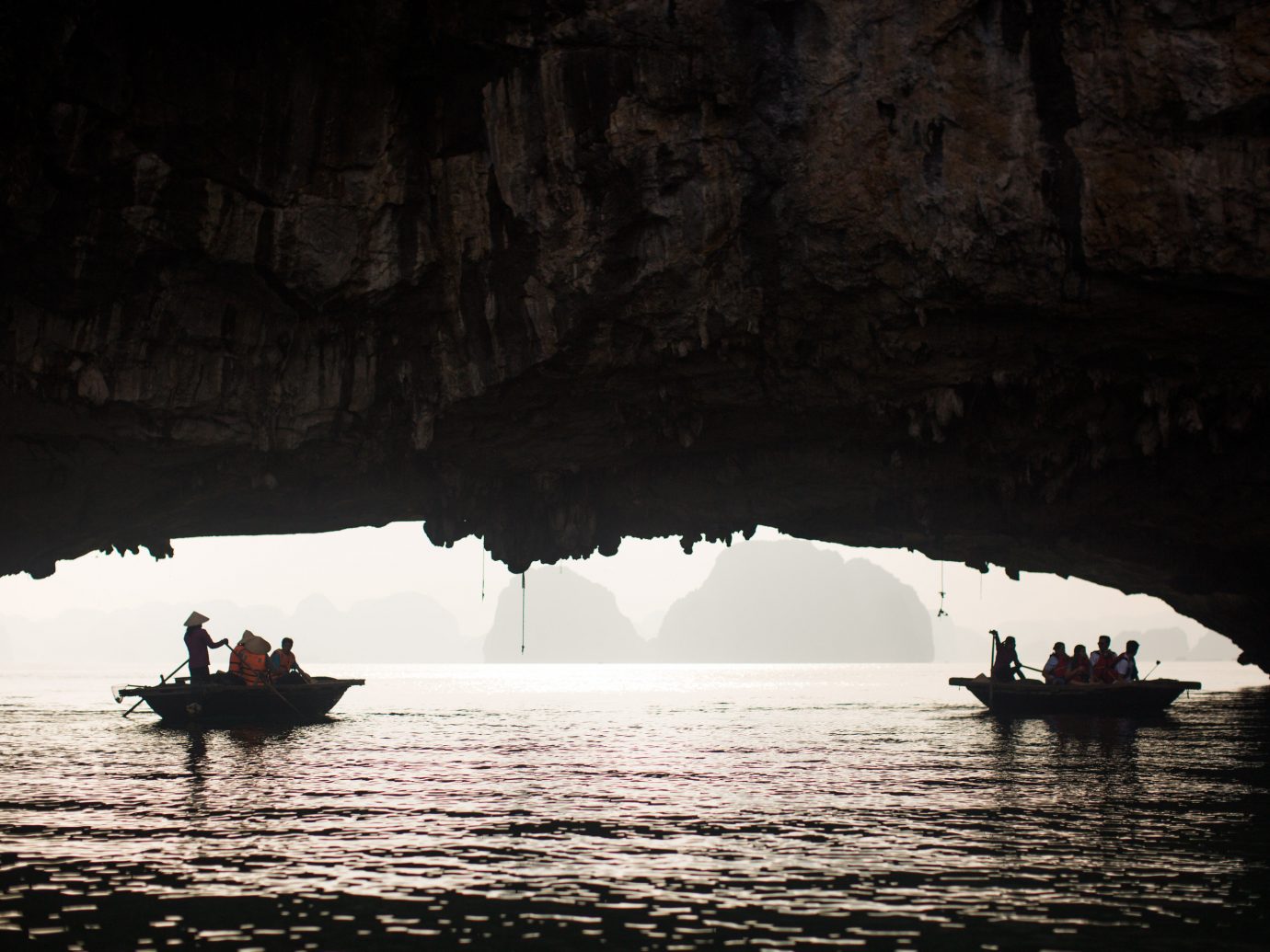 water outdoor Nature cave Boat geographical feature landform sea cave darkness reflection Sea formation bay distance