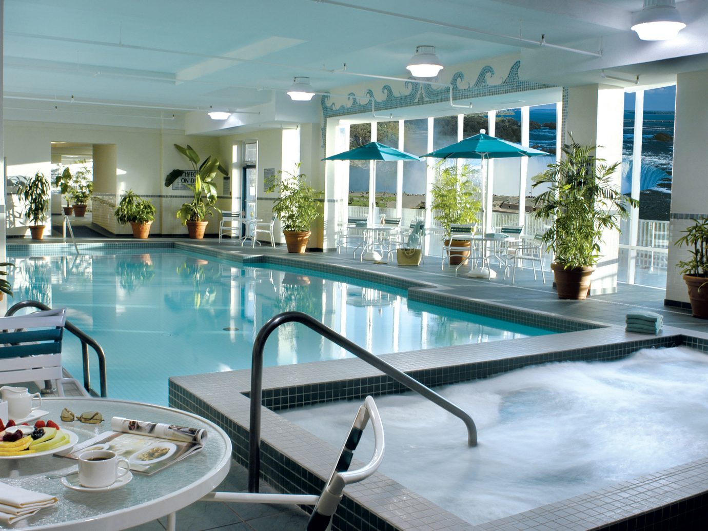 Hotels table indoor swimming pool property ceiling leisure window leisure centre Resort real estate apartment condominium Dining interior design hotel estate amenity resort town penthouse apartment dining table