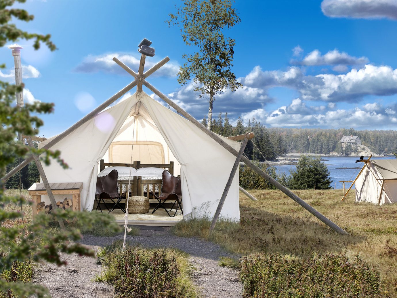Glamping Luxury Travel Outdoors + Adventure Trip Ideas Weekend Getaways sky outdoor tree grass building cottage home tepee hut house rural area real estate cloud yurt landscape mountain