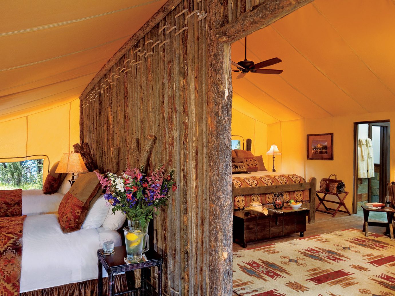 Glamping Hotels Luxury Travel Montana Outdoors + Adventure Trip Ideas indoor Living room wall floor sofa property ceiling estate furniture house living room cottage Villa home farmhouse decorated interior design real estate Bedroom mansion Suite