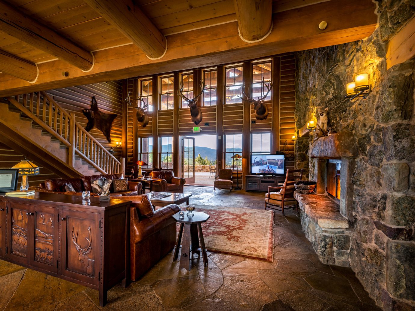 ambient lighting Cabin calm cozy extravagant Fireplace isolation Lodge log cabin Lounge Luxury Mountains Nature Outdoors remote Rustic serene Trip Ideas view warm indoor ceiling room estate building house home interior design wood restaurant Bar tavern furniture stone