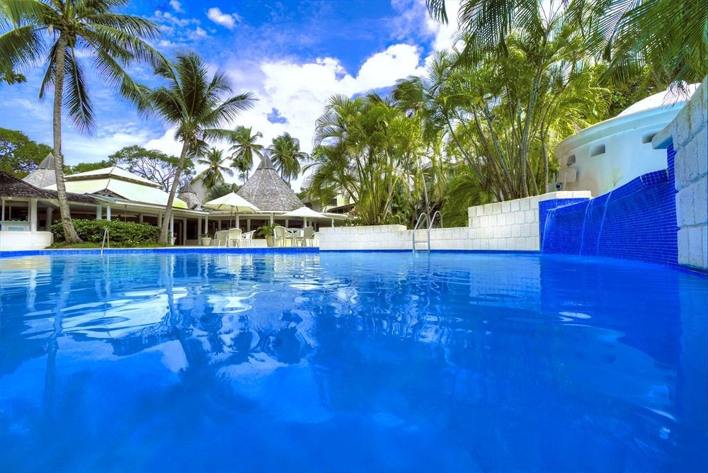 tree swimming pool property Pool leisure blue Resort resort town Villa backyard swimming surrounded