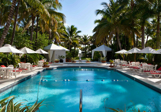 tree Pool swimming pool Resort property leisure Villa resort town caribbean swimming condominium blue lined