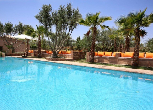 tree sky Pool swimming pool Resort property leisure Villa resort town swimming condominium blue