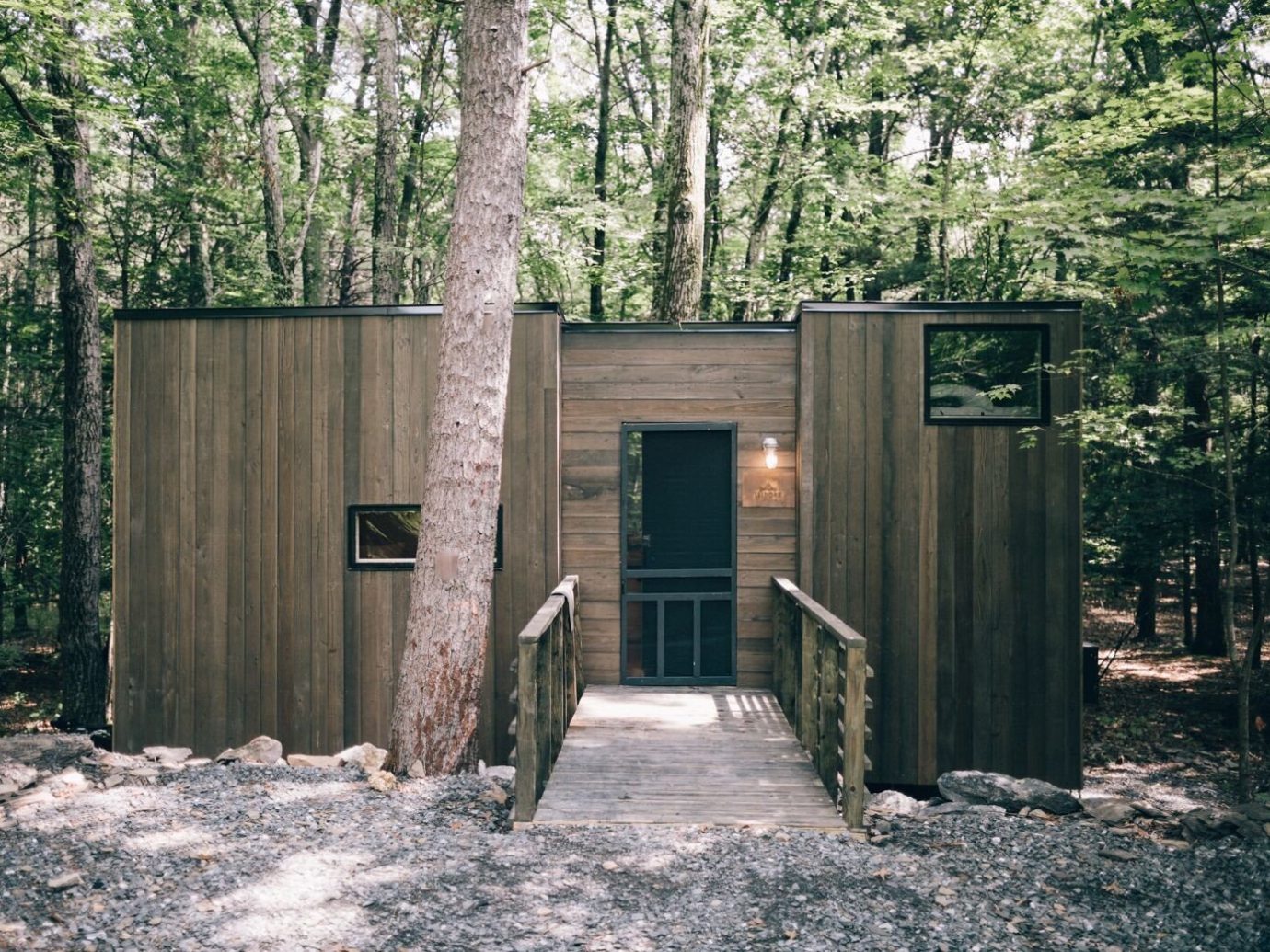Boutique Hotels Fall Travel Hotels Outdoors + Adventure tree outdoor ground house shed Architecture cottage home outhouse shack siding wood real estate outdoor structure log cabin facade garden buildings state park hut Forest
