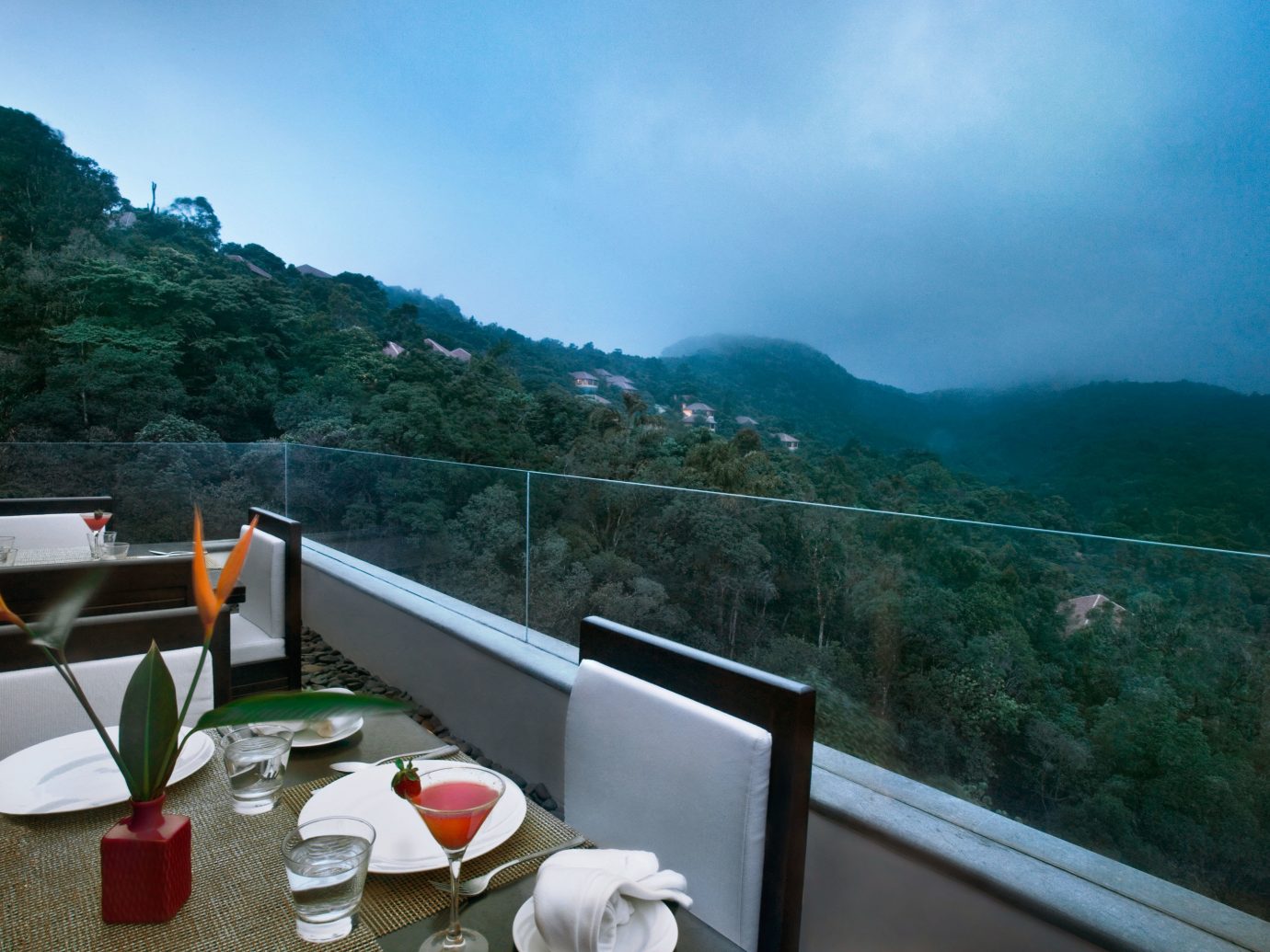 Balcony Dining Drink Eat Elegant Forest Hotels Luxury Patio Scenic views Terrace outdoor mountain vacation tourism travel Sea mountain range