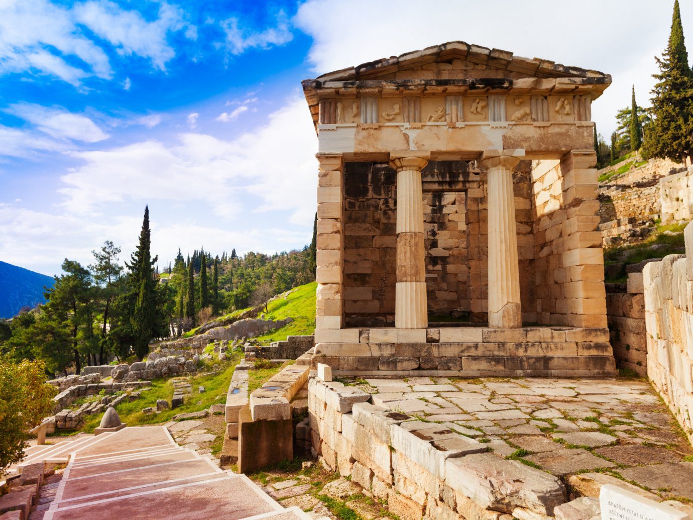 Arts + Culture Landmarks Trip Ideas sky outdoor historic site building archaeological site ancient history Ruins temple tourism tourist attraction history stone facade tree ancient greek temple estate ruin
