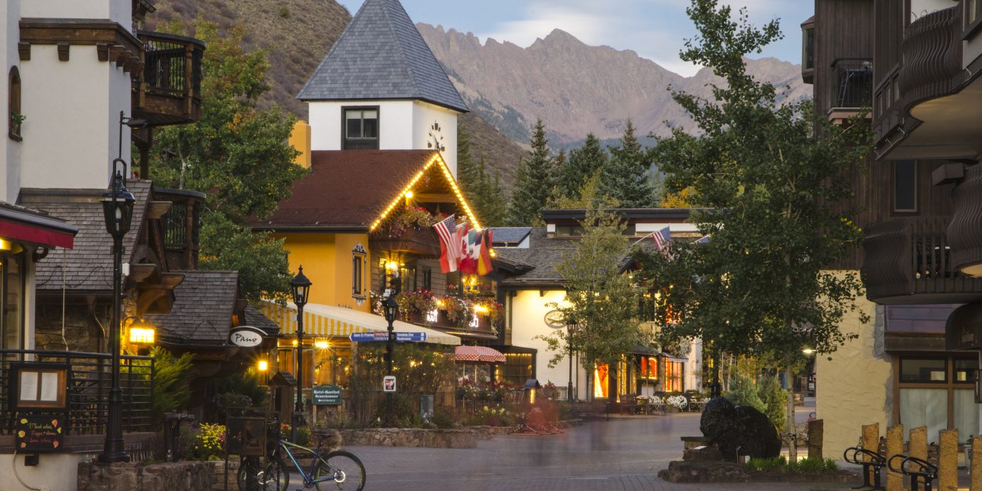 Mountains + Skiing Outdoors + Adventure building outdoor road Town house neighbourhood City way human settlement street vacation residential area Village tourism Downtown sidewalk travel restaurant