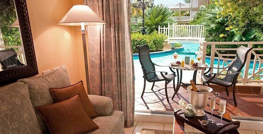chair property home Villa Resort living room cottage mansion condominium Suite hacienda backyard