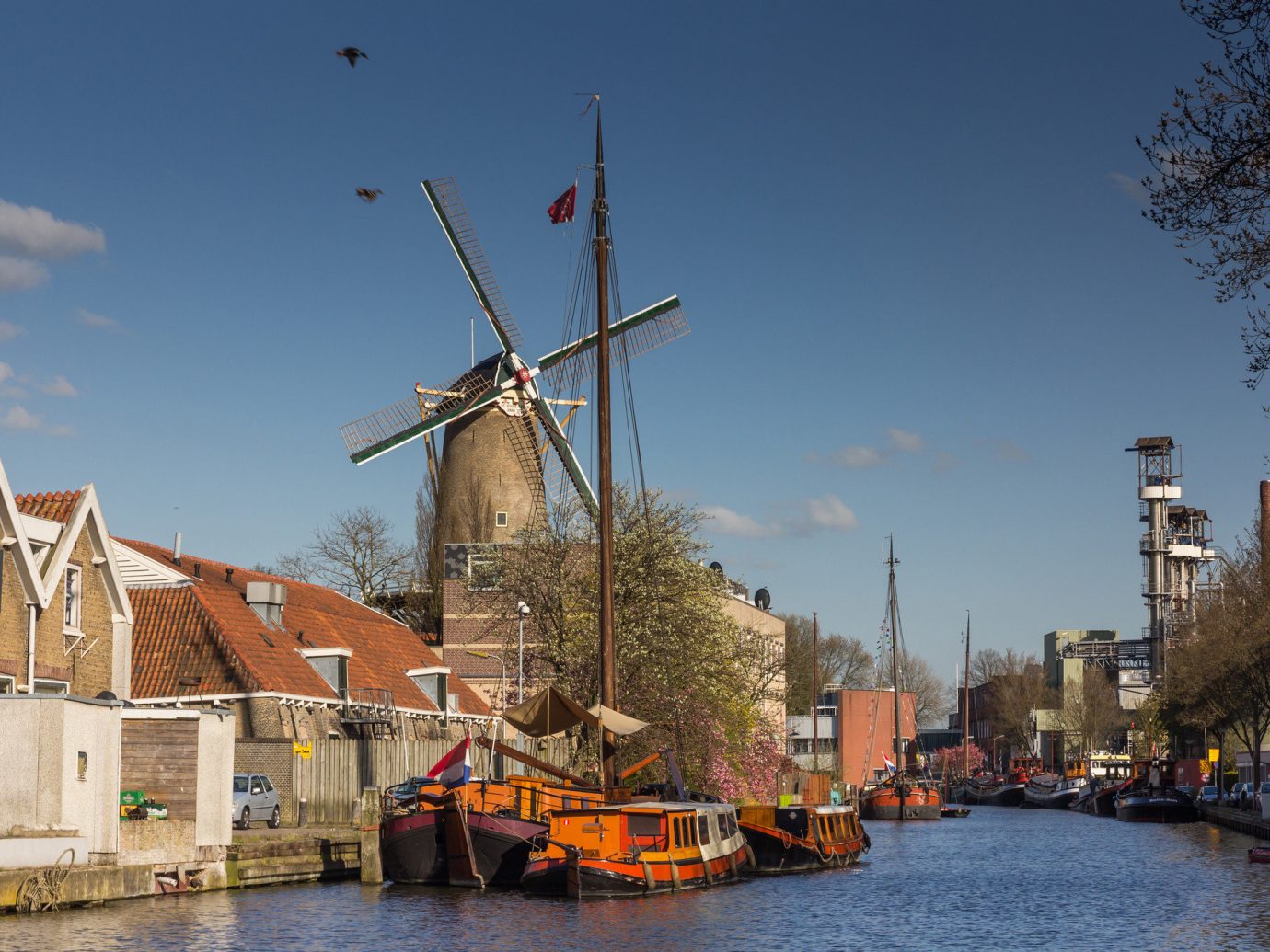Trip Ideas outdoor sky water waterway Boat Canal tree building City River windmill plant evening channel
