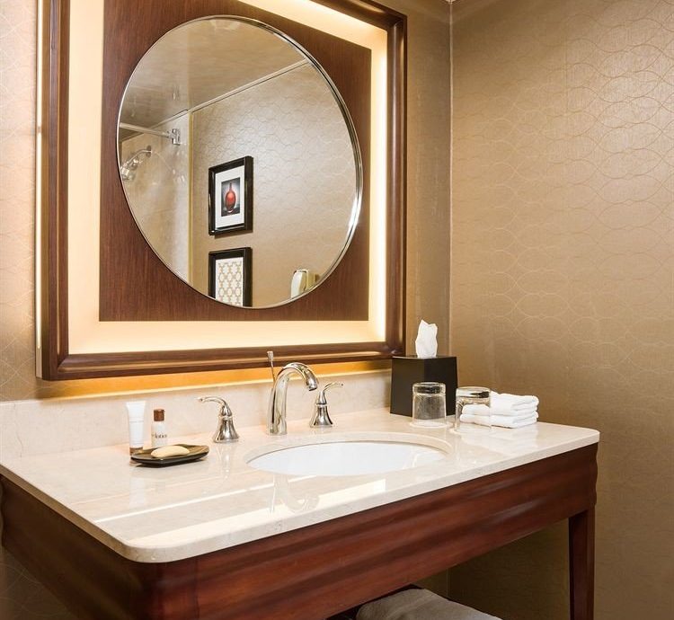 bathroom mirror sink plumbing fixture Suite cabinetry lighting bathroom cabinet