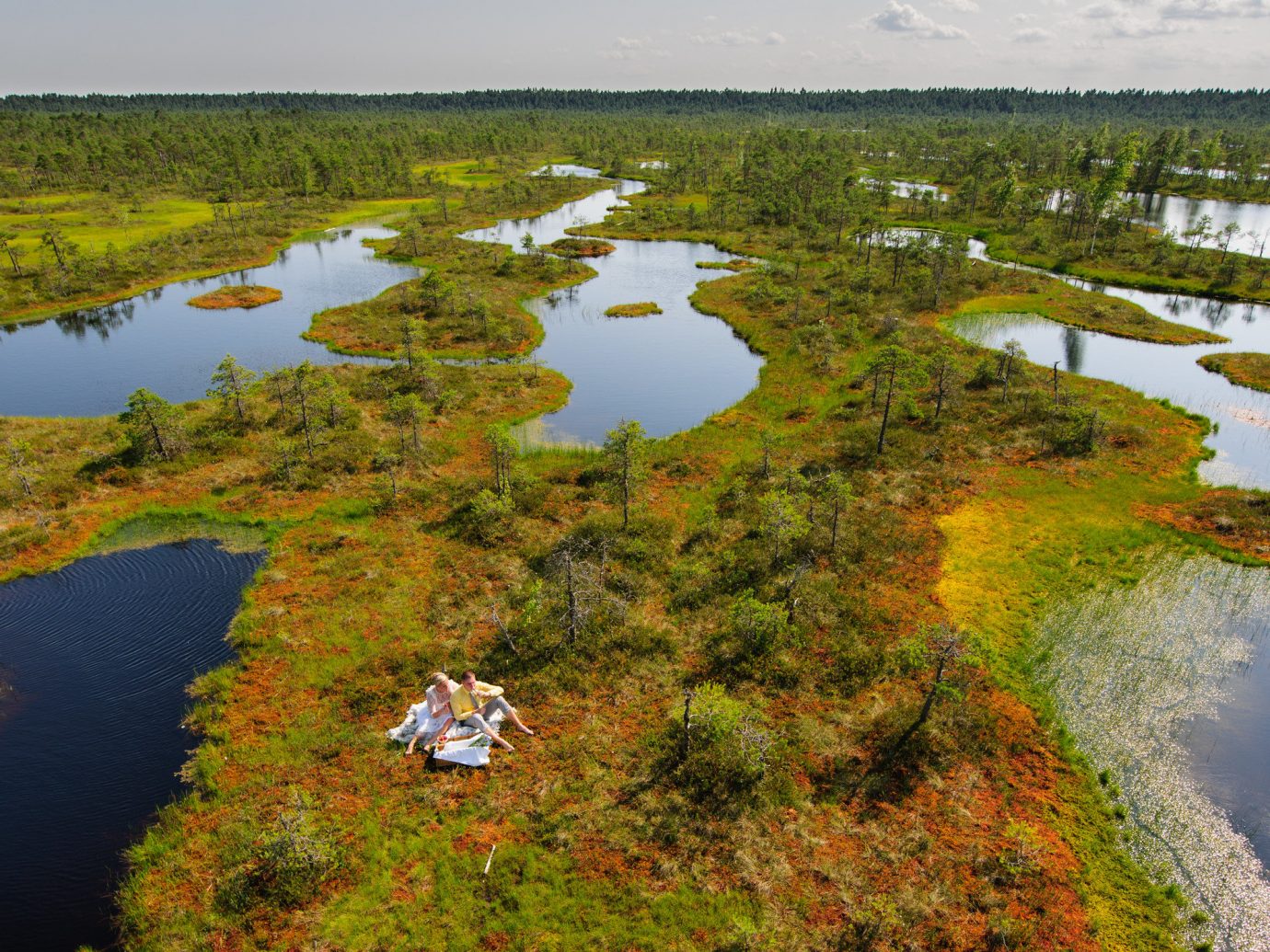 Offbeat grass water outdoor sky River habitat aerial photography wetland geographical feature Nature reflection natural environment wilderness ecosystem plain marsh tundra Lake floodplain green bog reservoir loch estuary pond biome swamp plateau grassy lush surrounded hillside land traveling