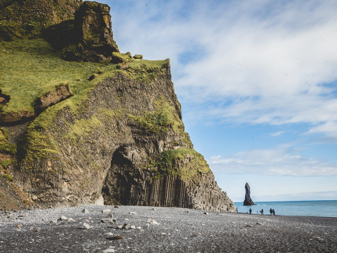 Adventure Beach black sand calm cave Greenery Hotels Iceland isolation Luxury Travel Nature Ocean Outdoor Activities people remote rock Rocks sand serene Travel Tips Trip Ideas outdoor Sea Coast cliff body of water shore vacation terrain cape tower bay material Ruins