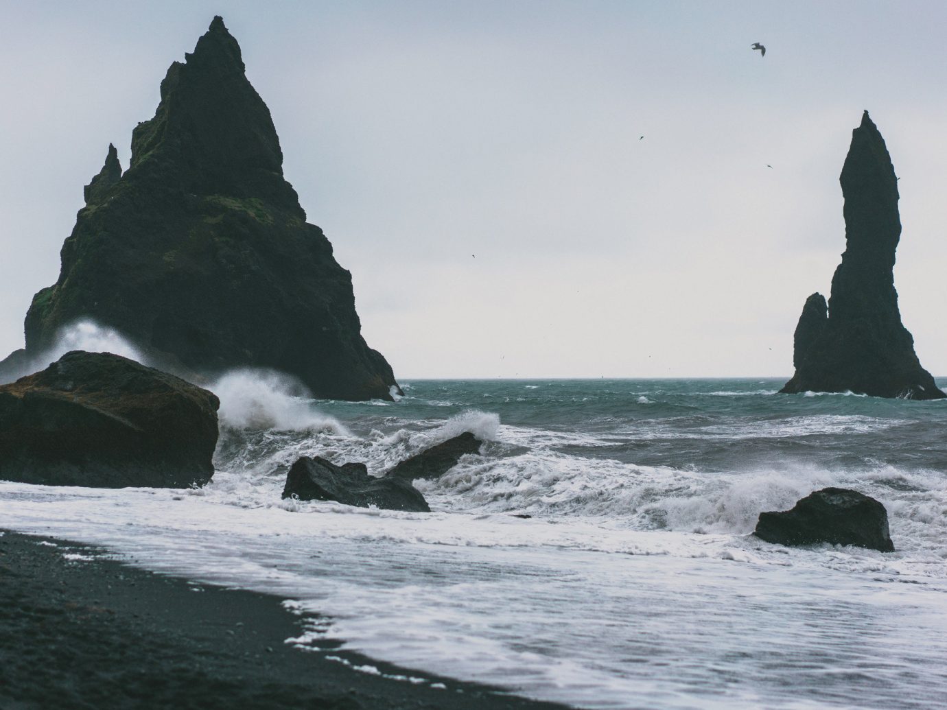 Iceland Outdoors + Adventure outdoor water sky Sea Coast coastal and oceanic landforms Ocean Nature wave headland shore promontory rock mountain wind wave stack rocky cape terrain cliff islet klippe tide formation