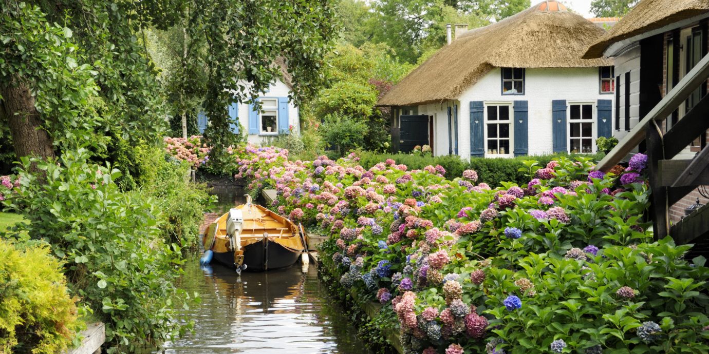 Trip Ideas tree outdoor house water geographical feature flower Canal waterway River Village Garden cottage estate surrounded Town