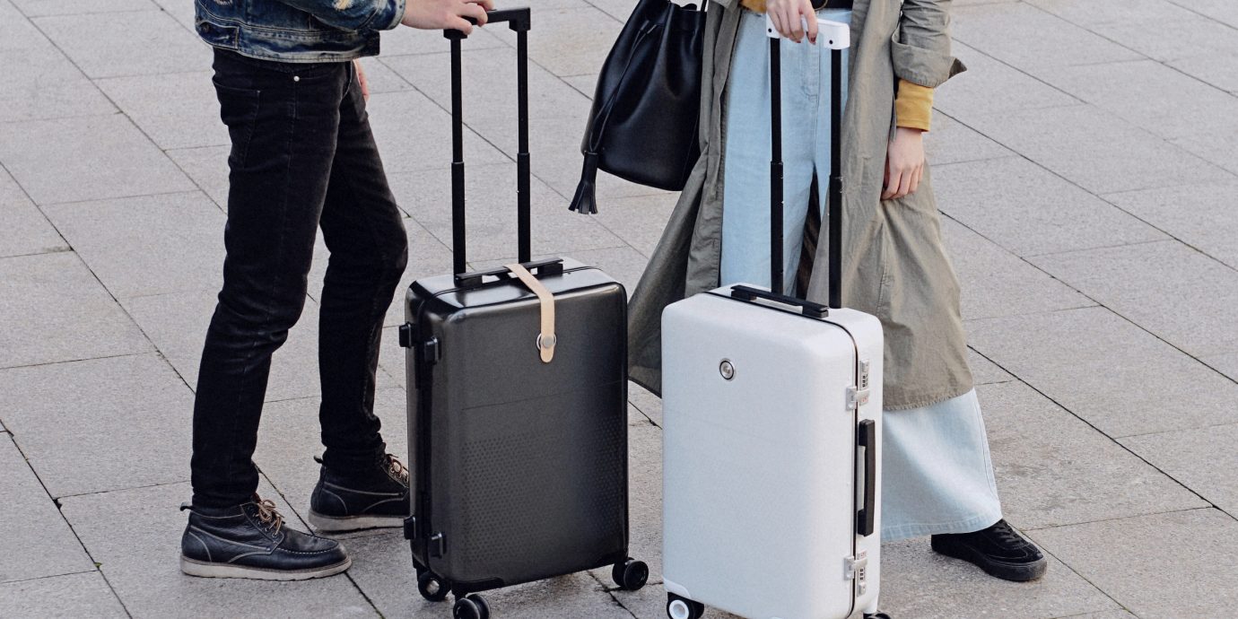 Celebs Style + Design Travel Shop ground outdoor person standing suitcase sidewalk way flooring