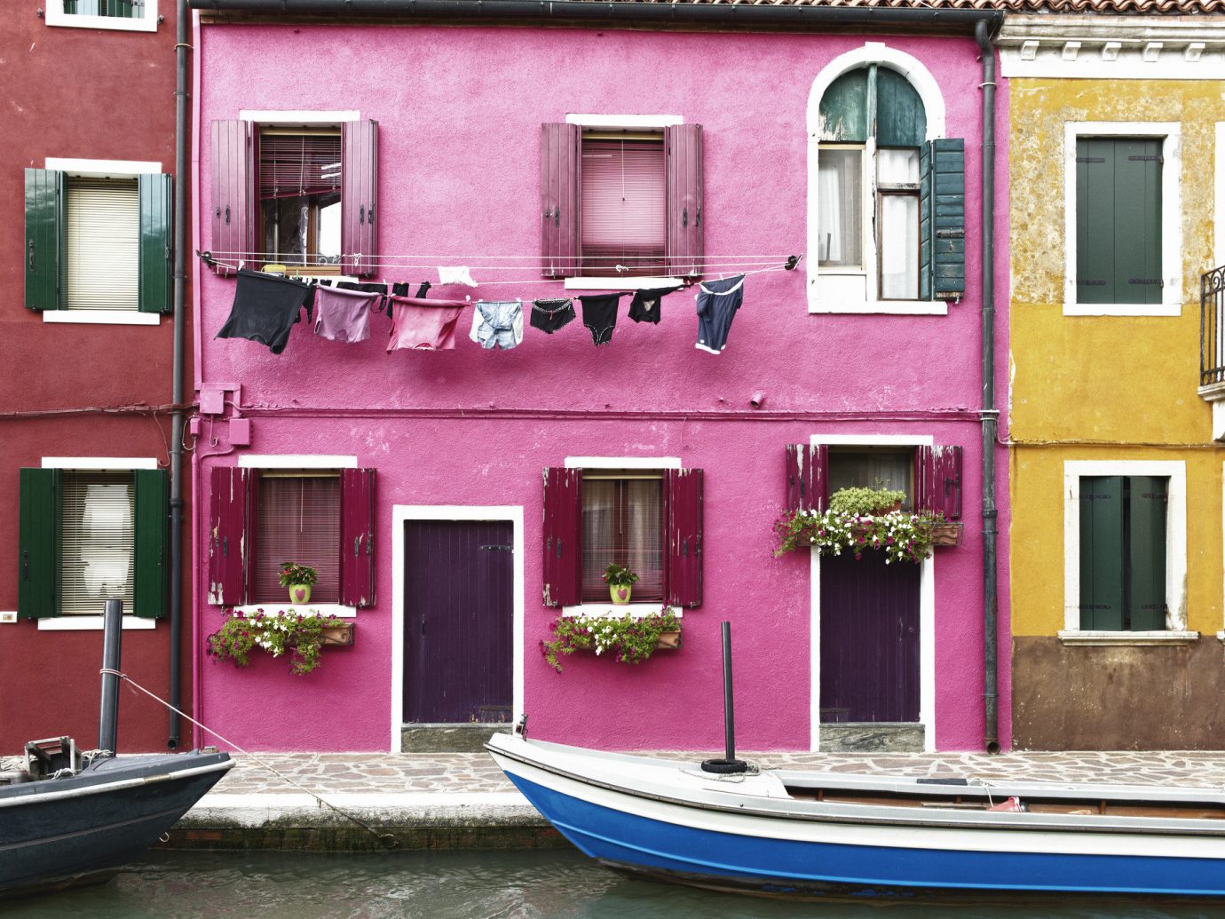 Offbeat outdoor color house pink home facade vehicle interior design Balcony old Boat colored