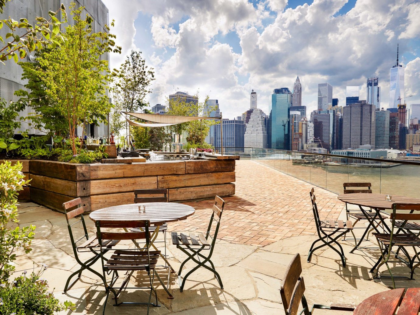 Food + Drink NYC property real estate tree outdoor structure City sky water roof plant Patio condominium