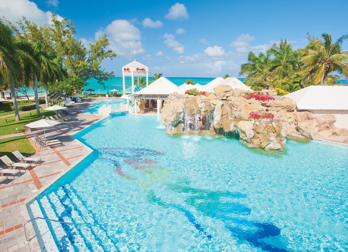 All-Inclusive Resorts Family Travel Hotels Resort leisure swimming pool caribbean vacation resort town tourism tropics water Lagoon palm tree coastal and oceanic landforms Water park bay Sea arecales sky recreation cay