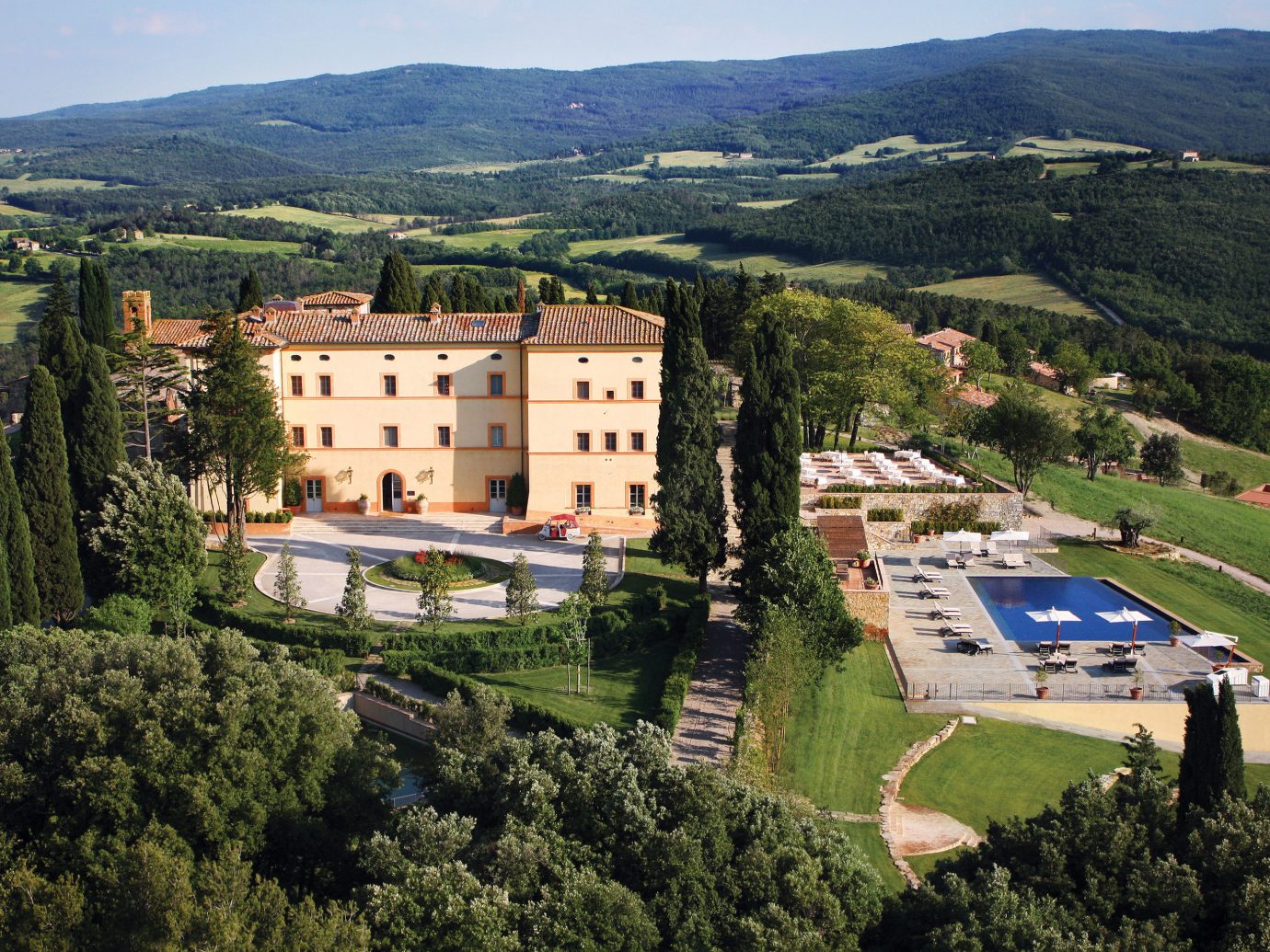 europe Hotels Italy Romance mountain tree outdoor grass sky aerial photography bird's eye view photography Town human settlement estate neighbourhood château Nature residential area hill hillside castle lush beautiful traveling