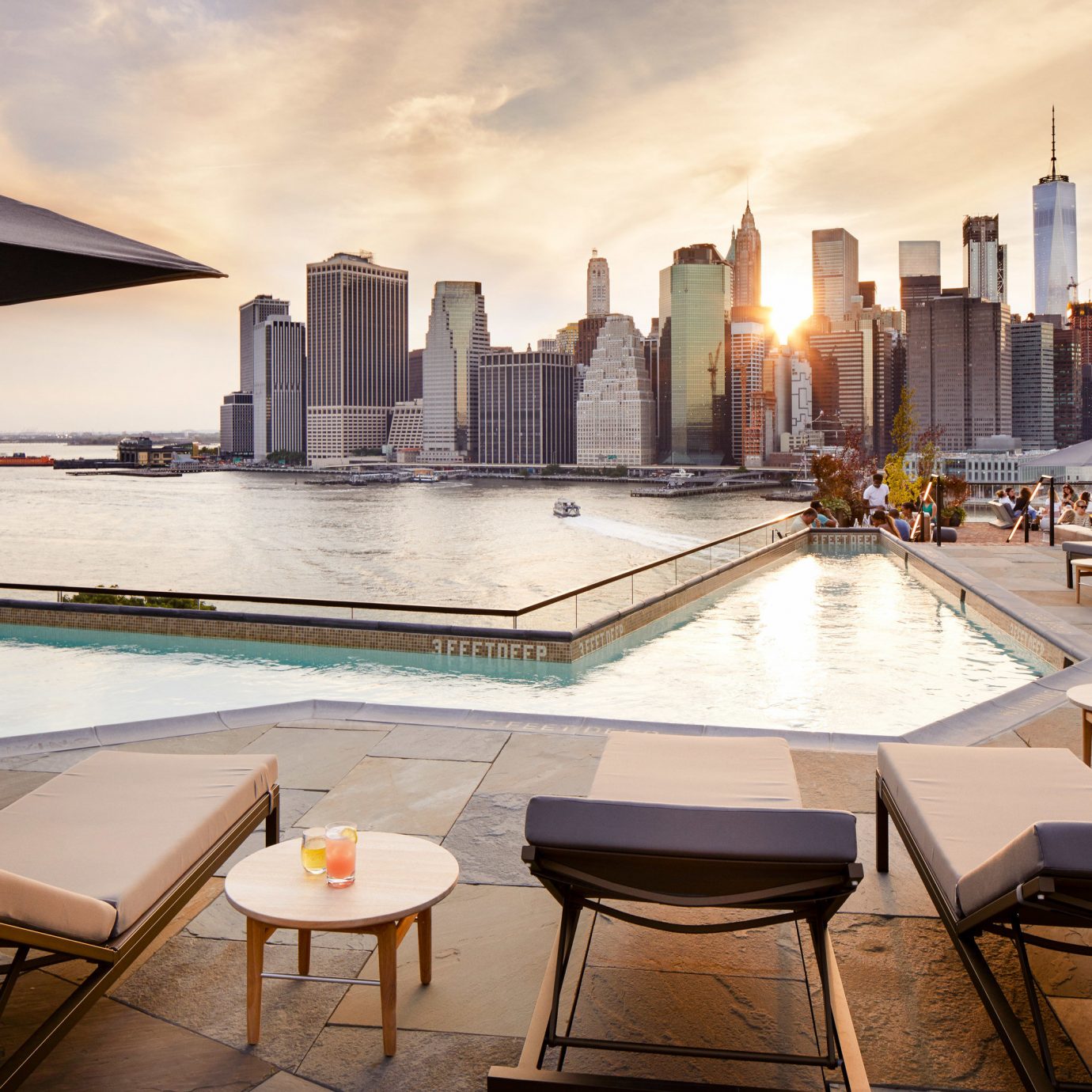 Food + Drink NYC sky table water condominium Architecture swimming pool reflection real estate apartment hotel building roof penthouse apartment City interior design Downtown cityscape window skyline
