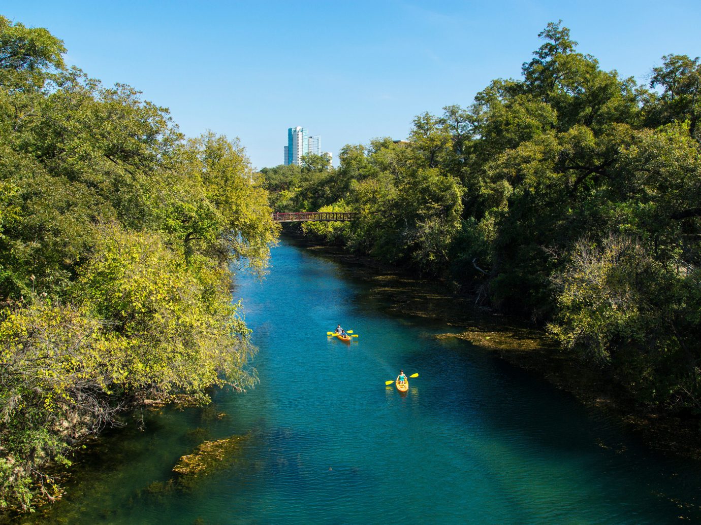 Austin Girls Getaways Texas Trip Ideas Weekend Getaways tree outdoor water sky Nature River landform geographical feature body of water waterway reflection reservoir Lake autumn Canal plant surrounded Forest wooded