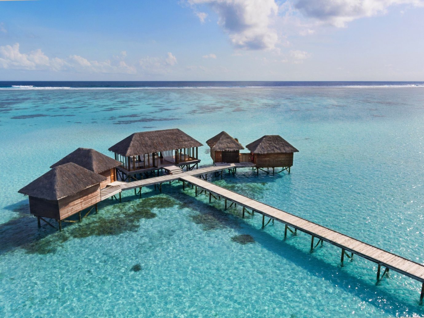 asia Beach Hotels Islands Maldives News Sea coastal and oceanic landforms Ocean Island Lagoon vacation swimming pool caribbean tropics islet sky Resort Coast tourism bay