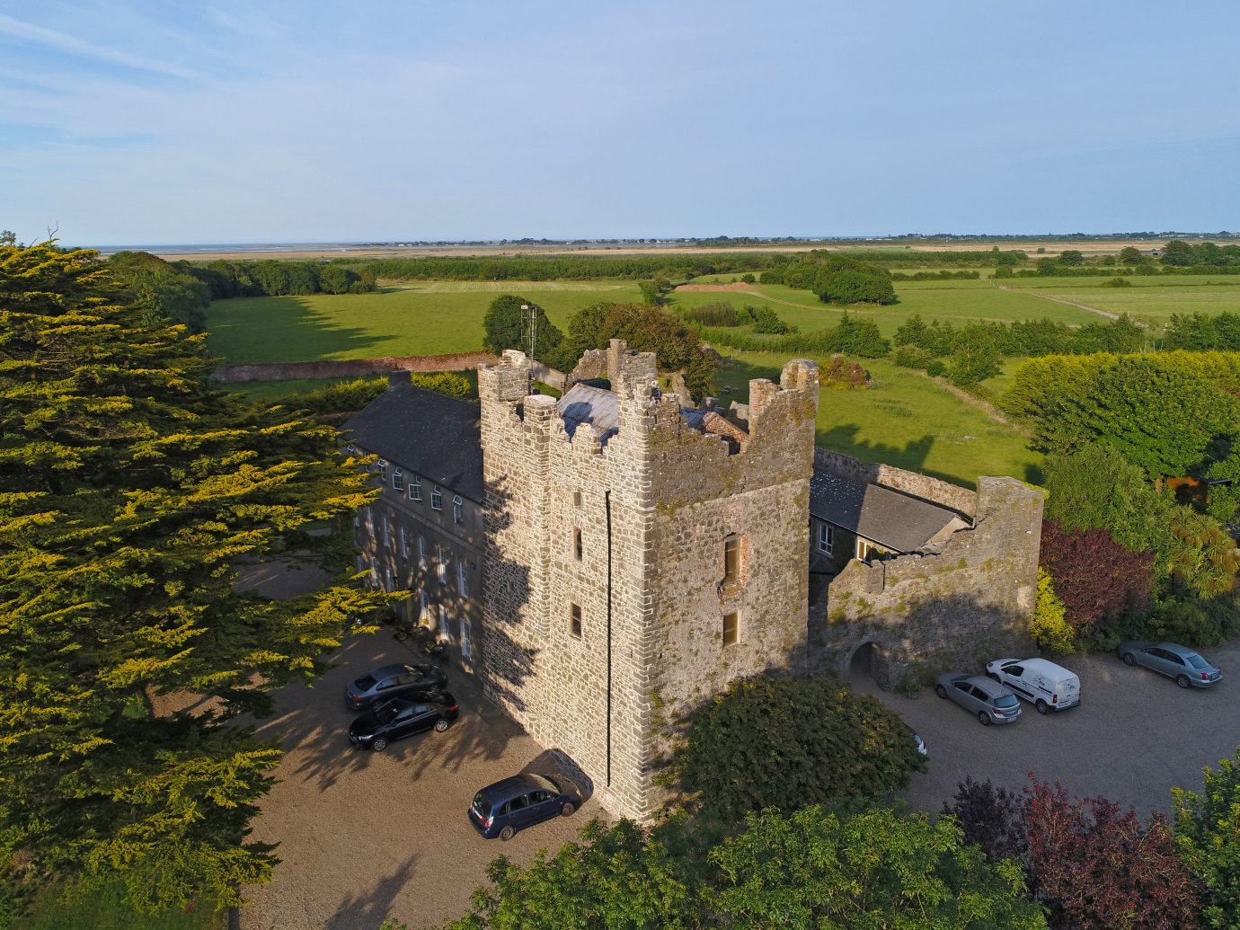europe Hotels Ireland sky tree aerial photography castle estate Village château plant rural area stately home national trust for places of historic interest or natural beauty building fortification landscape bird's eye view field grass historic site
