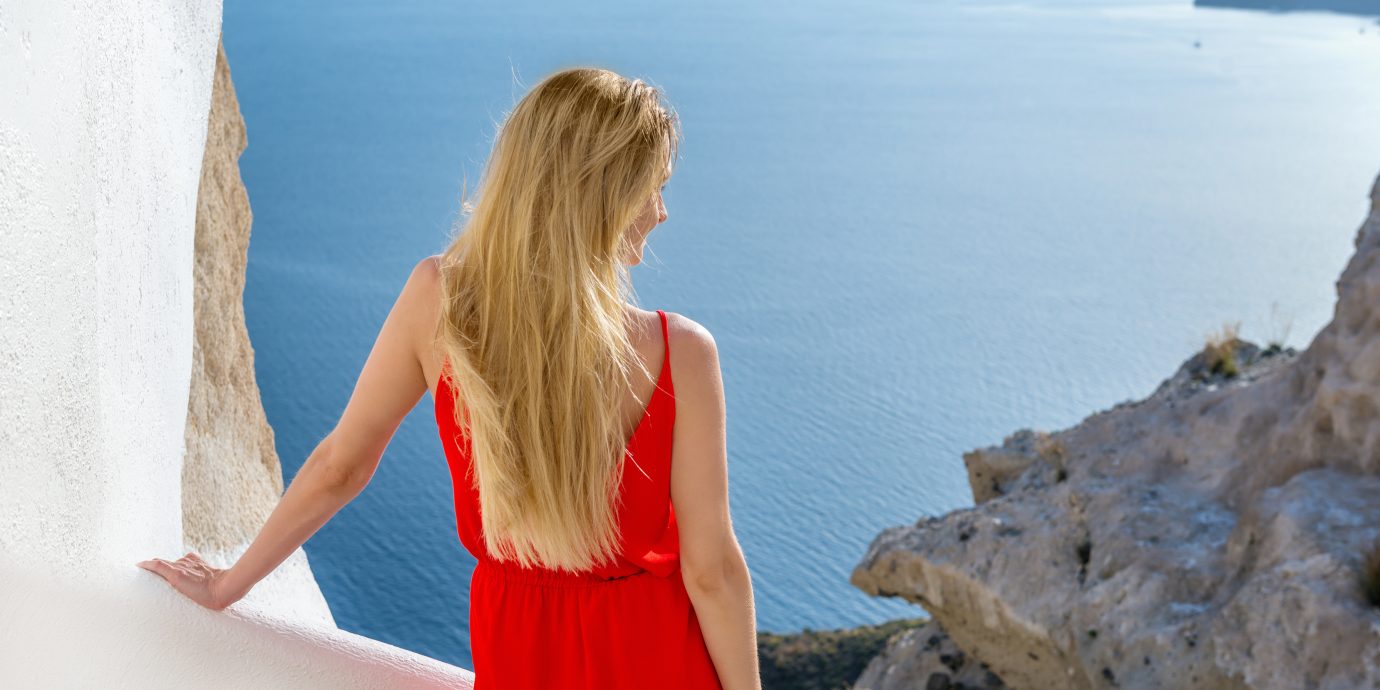 Best Jumpsuits for summer, woman in jumpsuit and view of the ocean
