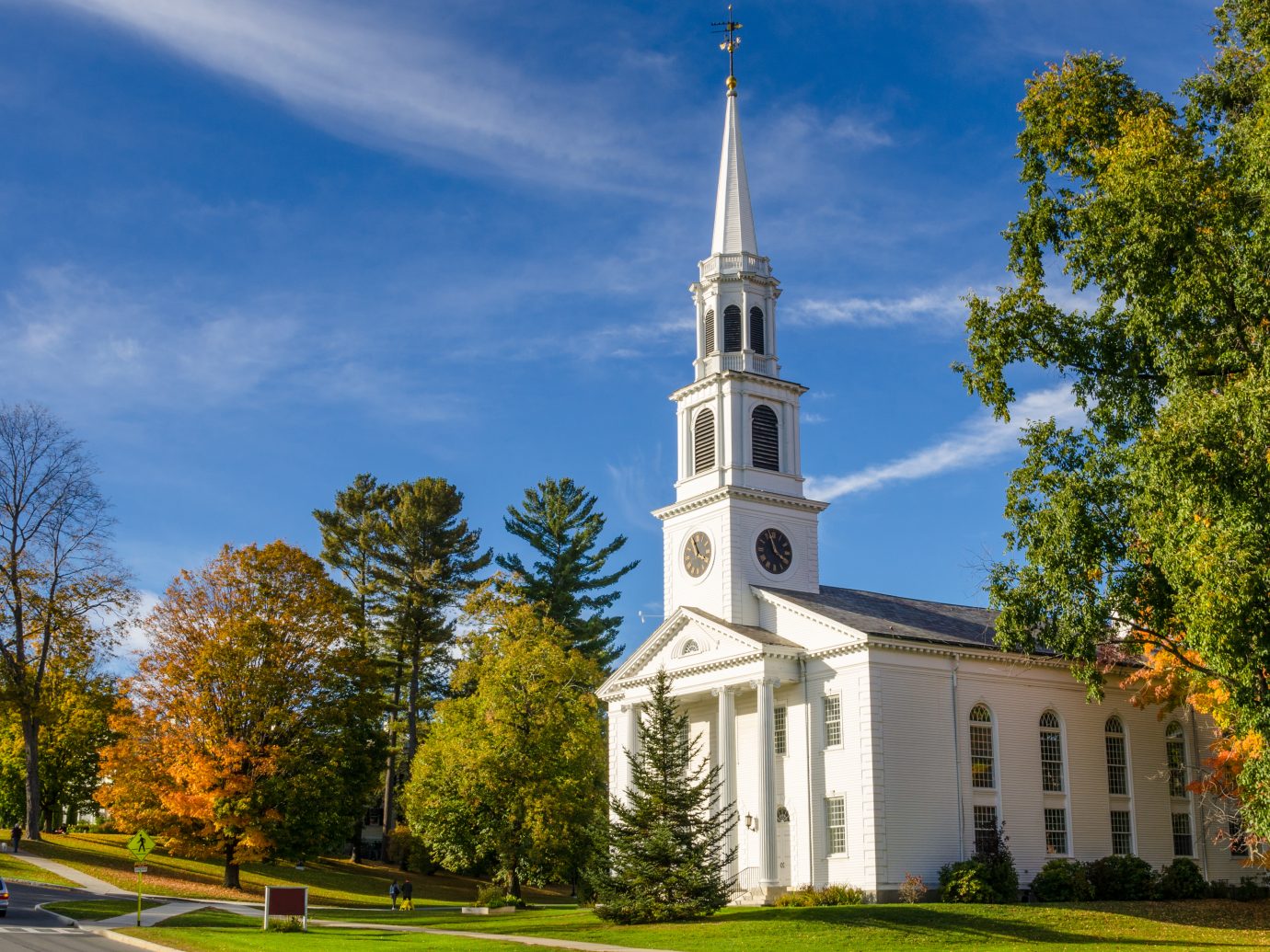 Traditional American White Church with a high Steeple in Williamstown, MA, on a Clear Autumn Day