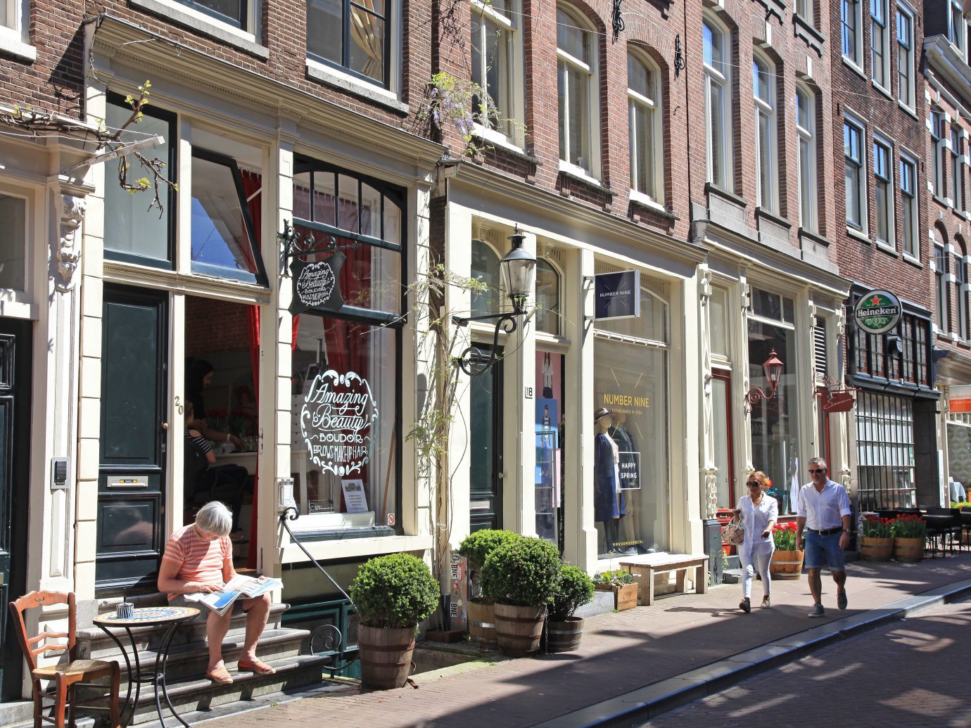 Amsterdam, Netherlands - May 8, 2016: Typical street in "??The Nine Streets"- special neighbourhood is full with vintage and designer shopping, speciality stores and cosy cafes, Amsterdam. Amsterdam is a capital and the largest city of Netherlands.