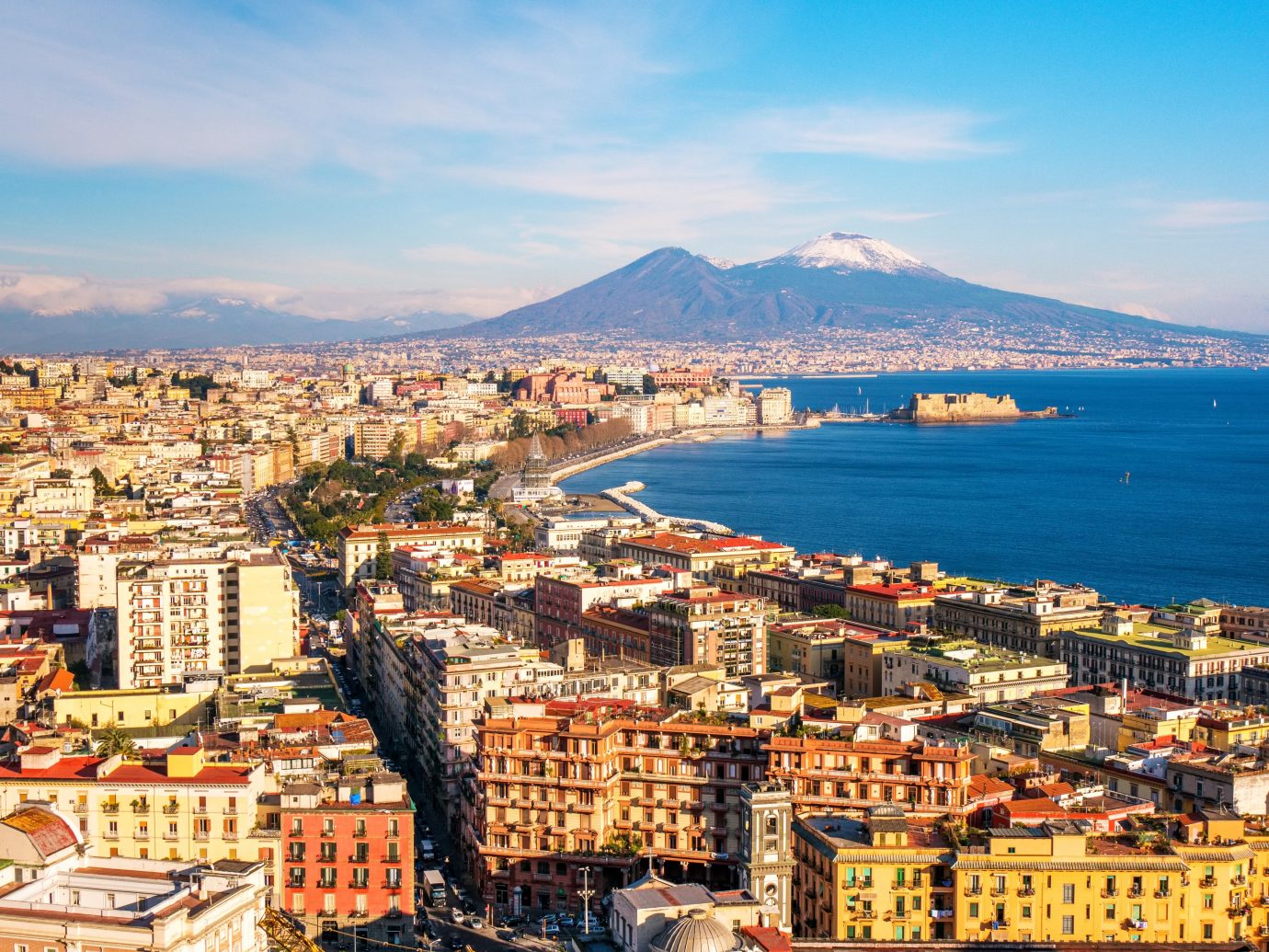 Panoramic aerial view of Naples with the unusually snowy Vesuvius volcano. Campania, southern Italy