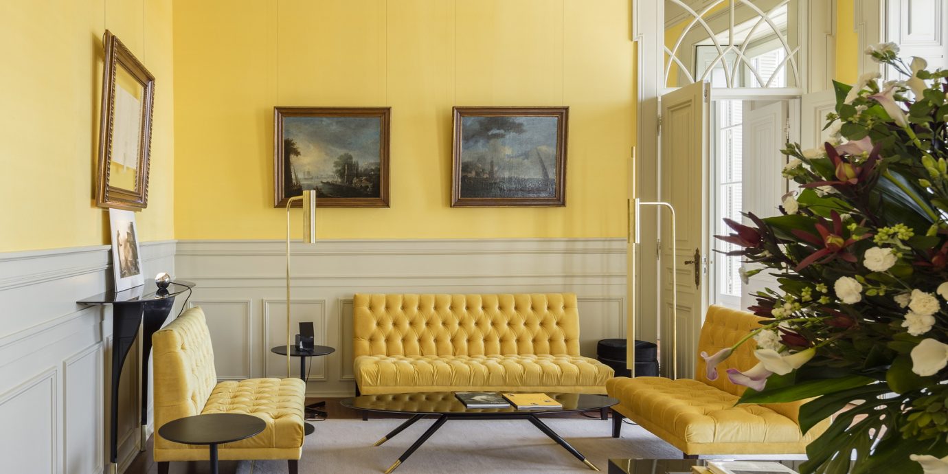 Luxurious room with bright yellow decor at Verride Palácio Santa Catarina