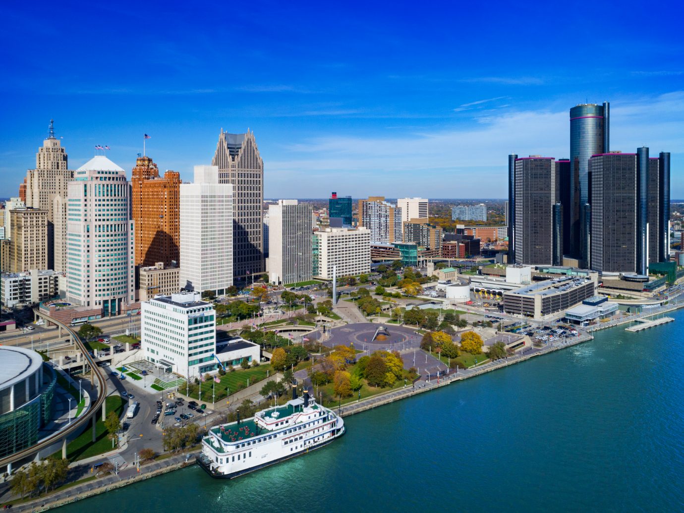 Downtown Detroit Aerial with Detroit River and a riverboat ferry in the foreground.