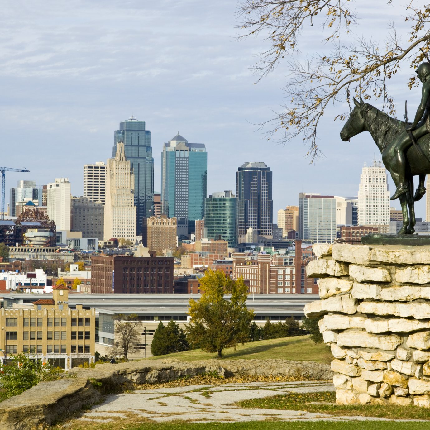 A view of downtown Kansas City, Missouri with the Scout statue in the foreground