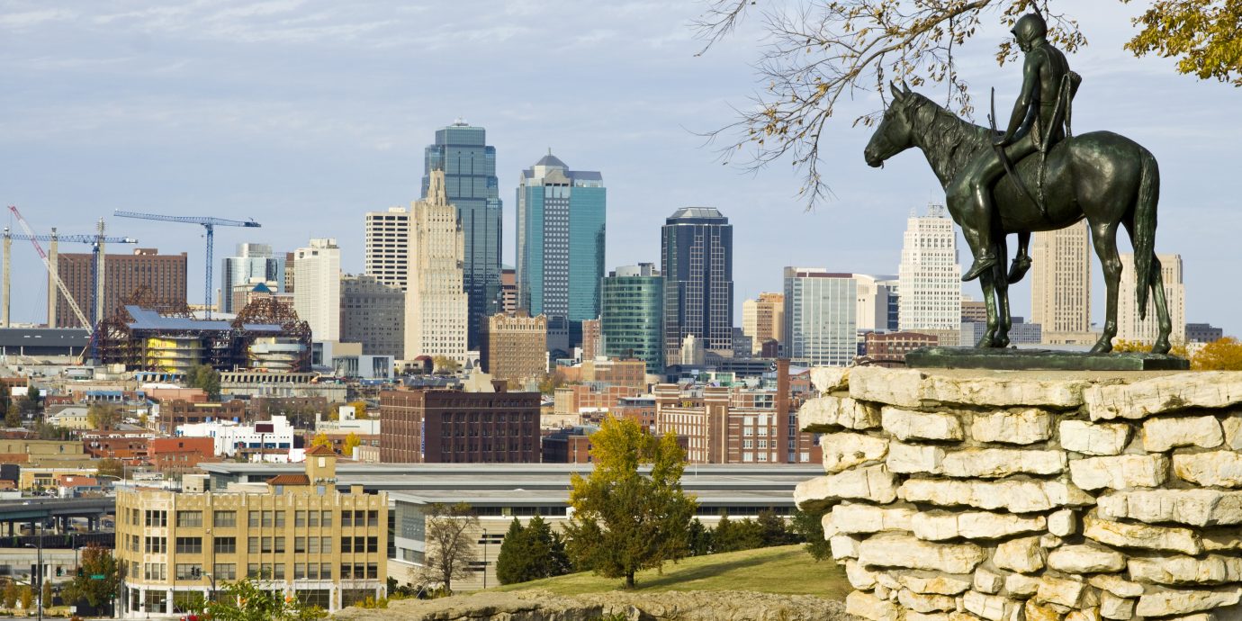 A view of downtown Kansas City, Missouri with the Scout statue in the foreground