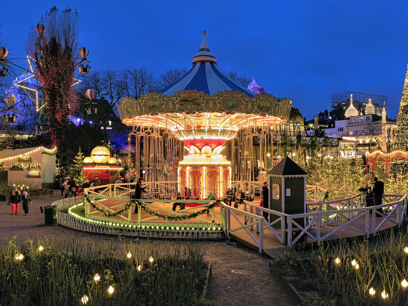 Chain carousel and christmas illumination in Tivoli Gardens. Tivoli Gardens is a famous amusement park and pleasure garden; it is the most-visited theme park in Scandinavia.