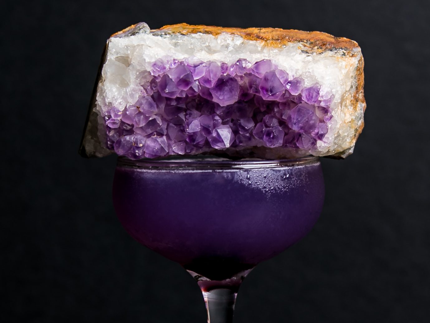 A purple Sundry + Vice cocktail, a classic Aviation called the Amethyst. It's butterfly pea-infused gin, maraschino, Creme de Violette, and lemon