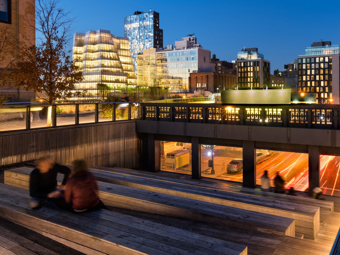 CROP of The High Line at twilight with a view on 10th Avenue with skyscrapers and building illumination. Chelsea, Manhattan, new York City, USA