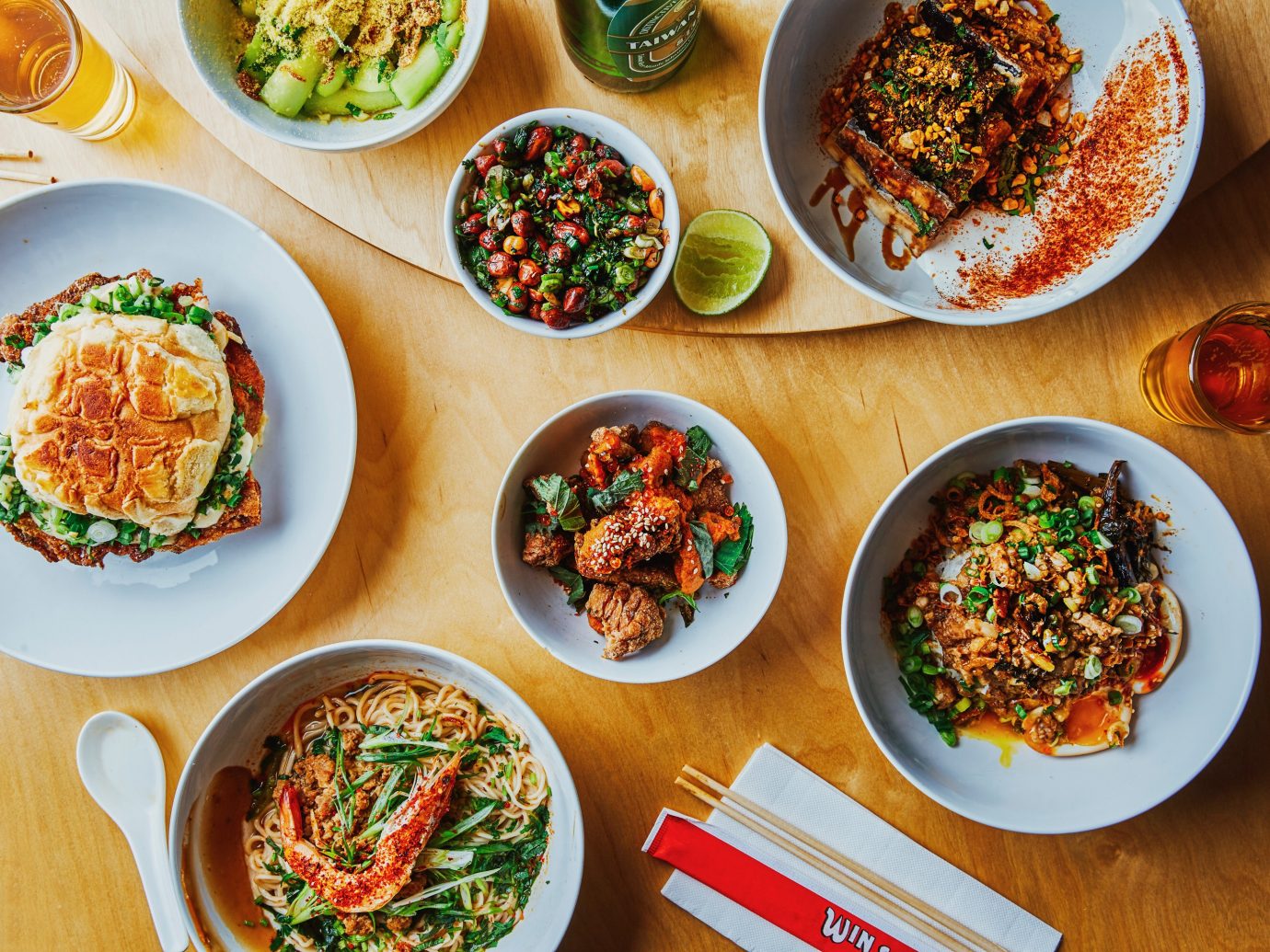 Overhead shot featuring numerous dishes at Win Son